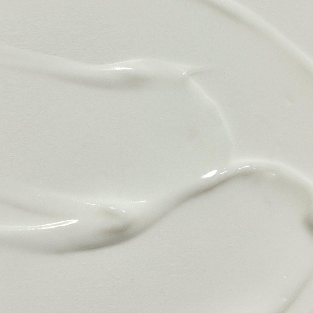 RŌZ Milk Hair Serum label closeup highlighting vegan formula.