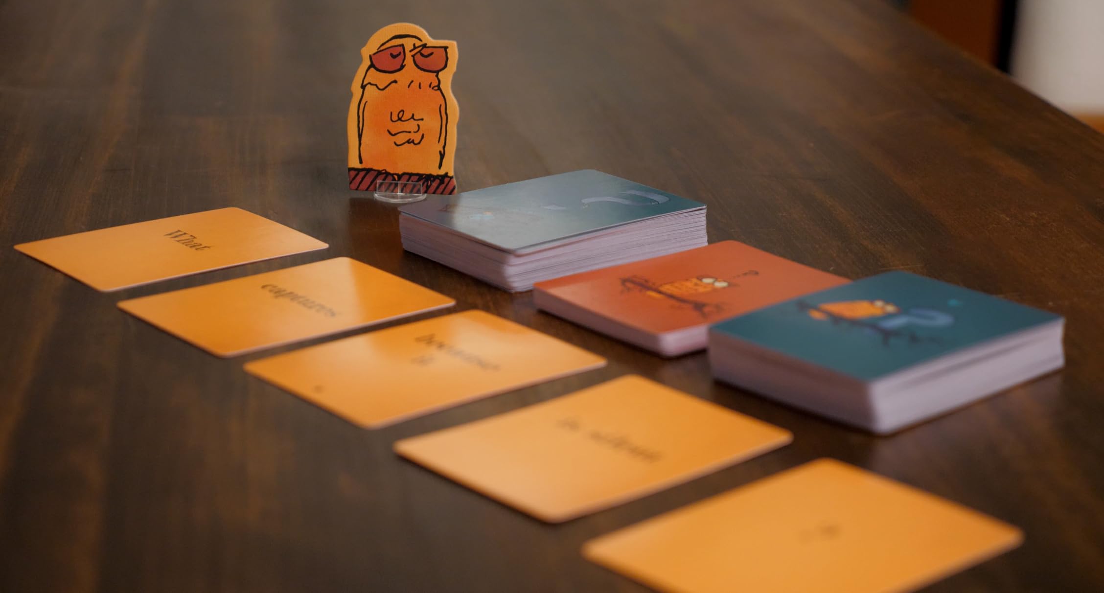 Runaway Parade Smug Owls players laughing around the table during play