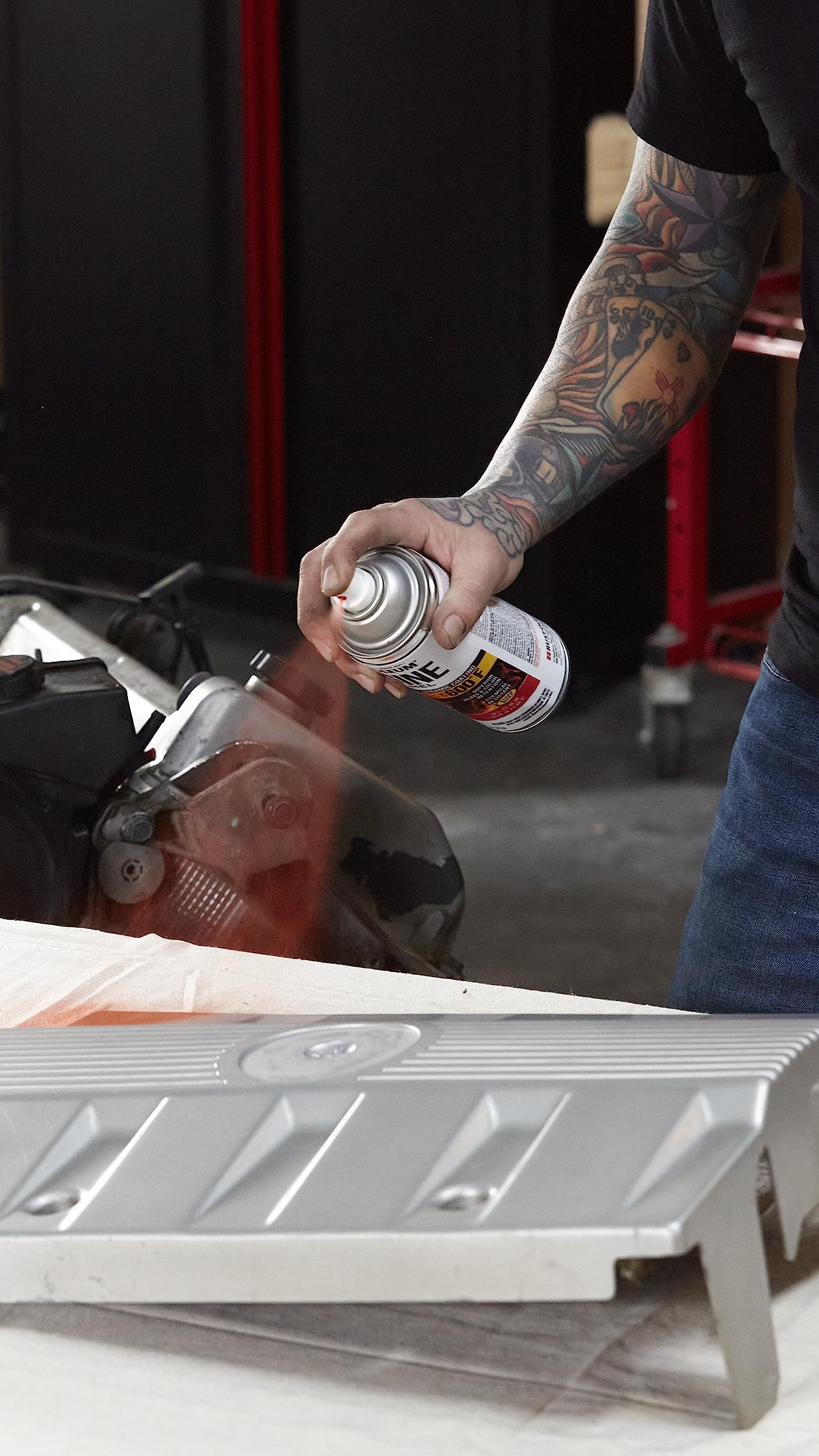 Any-angle spray reaching tight engine bays with Rust-Oleum Engine Enamel.