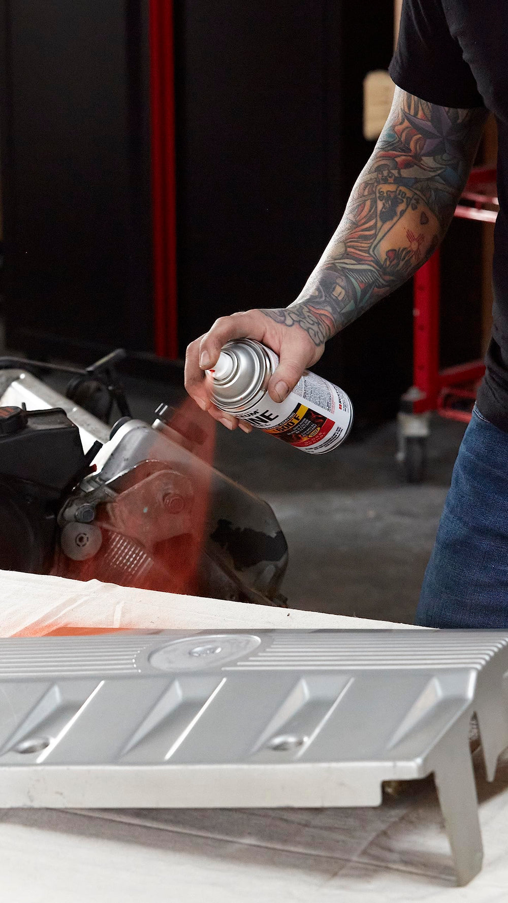 Any-angle spray reaching tight engine bays with Rust-Oleum Engine Enamel.