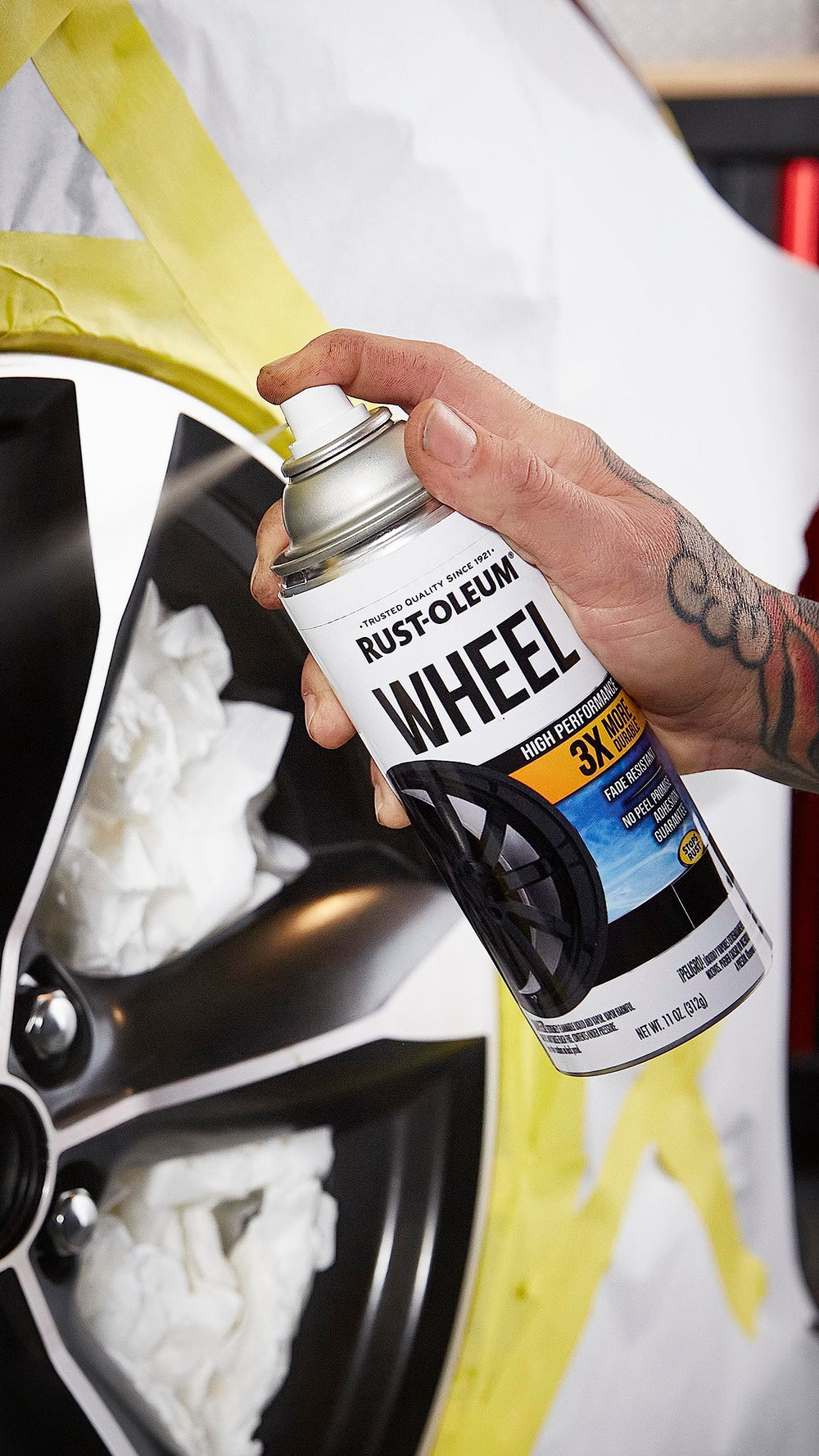 Rust-Oleum wheel coating spray demonstrates durability and even coverage during application