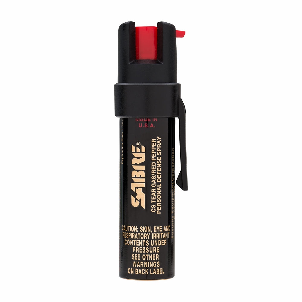 SABRE compact defense spray with belt clip for quick access.