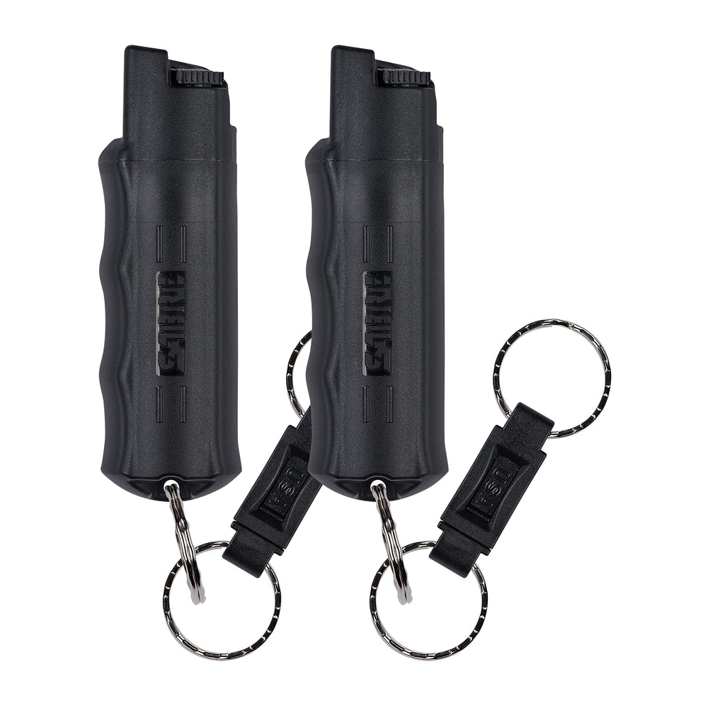 SABRE 3-in-1 Defense Spray bottle showing extended spray reach for self-defense.