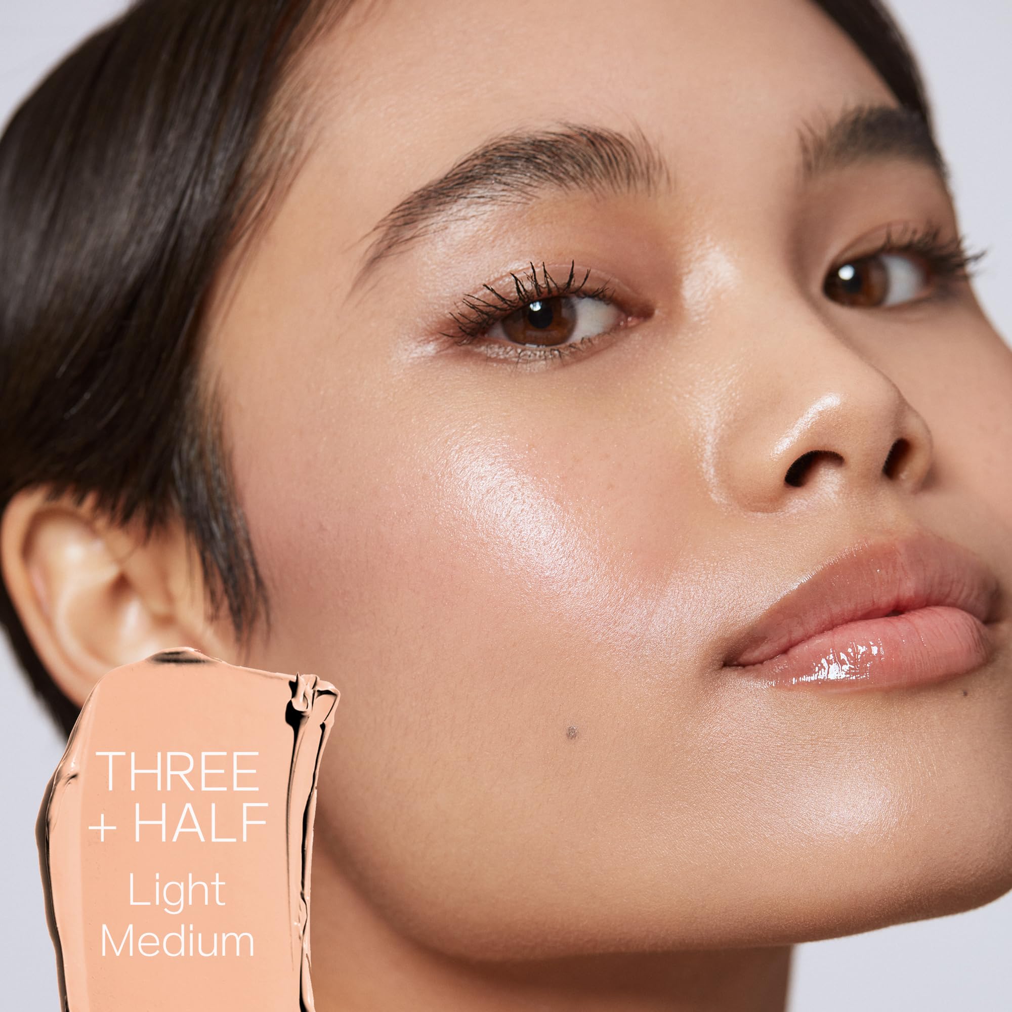 Saie Slip Tint SPF 35 swatch on skin illustrates smooth application and luminous finish.
