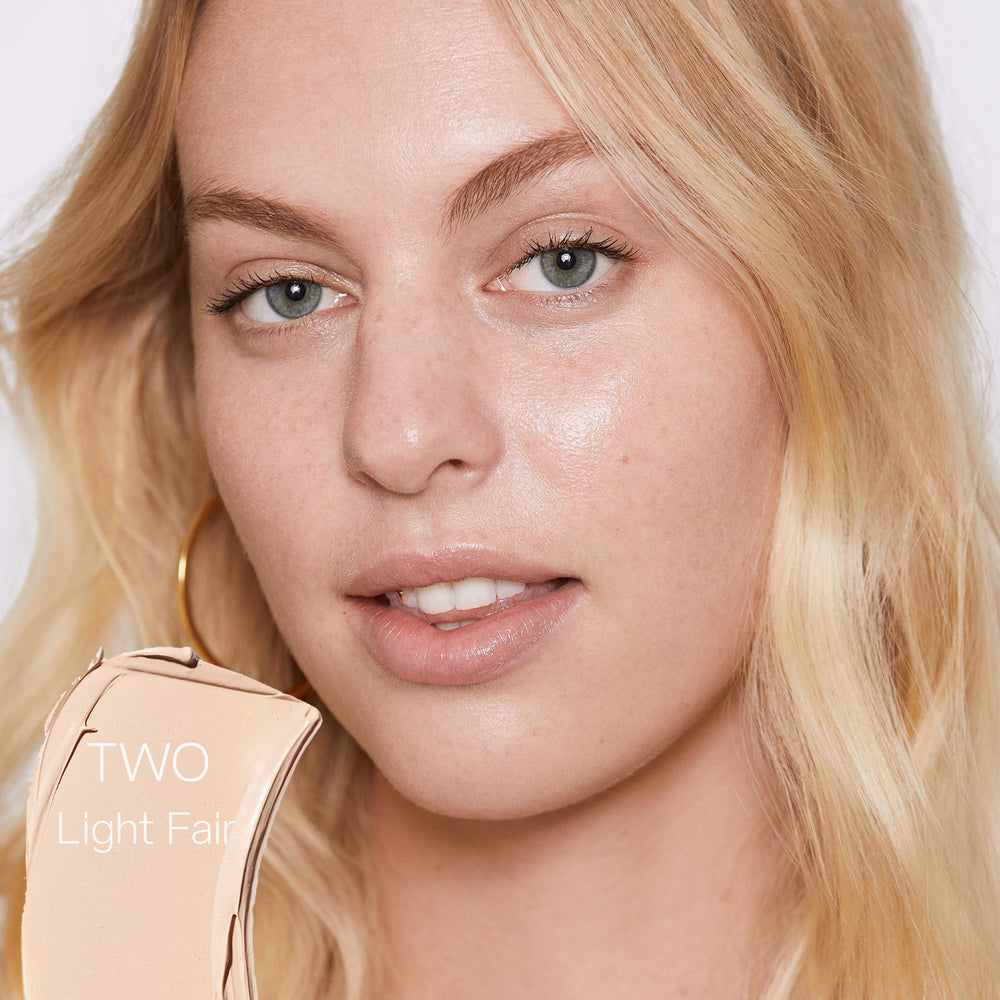 Saie Slip Tint SPF 35 shade two swatch reveals peach undertone and sheer coverage
