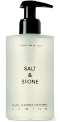 Salt & Stone facial cleanser bottle pouring for a refreshing cleanse.
