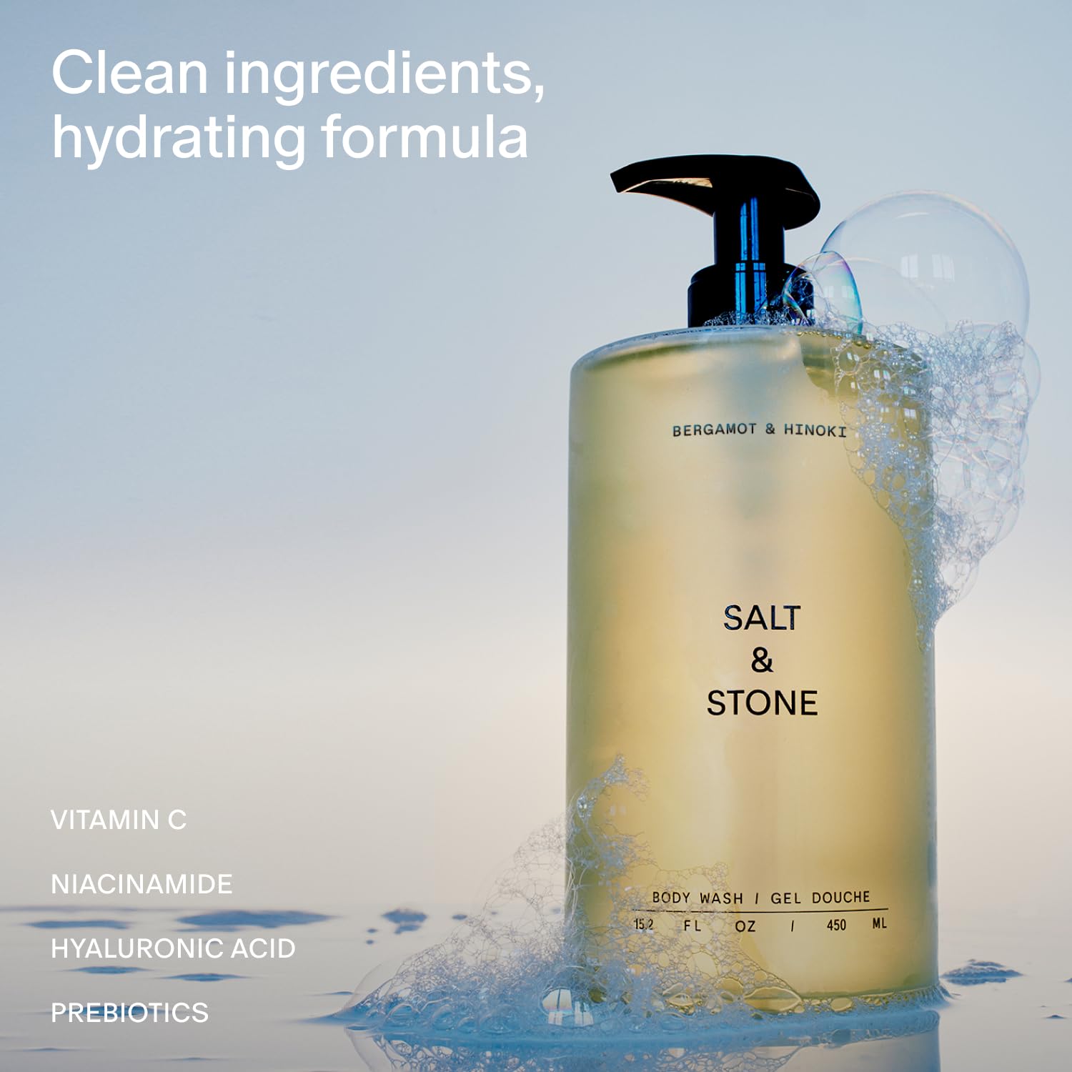 Salt & Stone bottle being poured to show rich lather and cleansing.