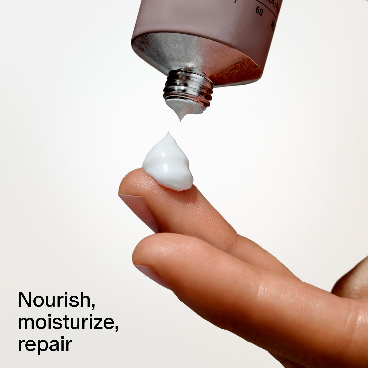 Applying the cream to hands, demonstrating quick-absorb formula.
