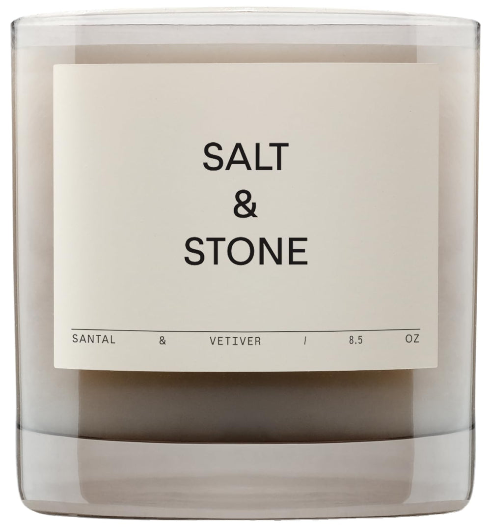 Salt & Stone Santal Vetiver candle in a jar creates a warm ambiance.
