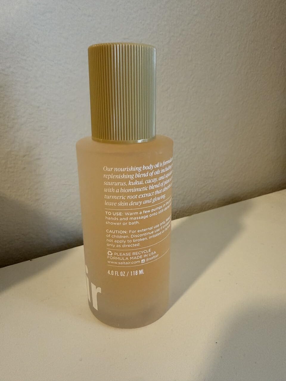 Saltair Body Oil applied to damp skin for fast absorption and a soft glow.