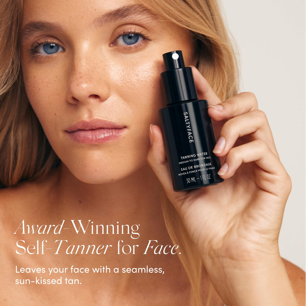 Fine-mist spray of SALTYFACE Tanning Water for even coverage.