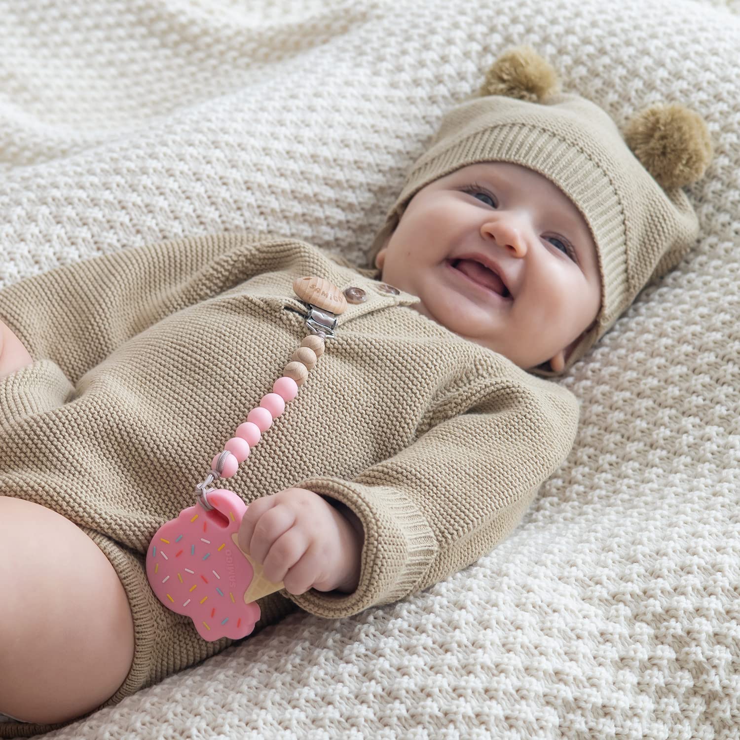 SAMiGO binky holder in lavender emphasizes easy cleaning with warm water.