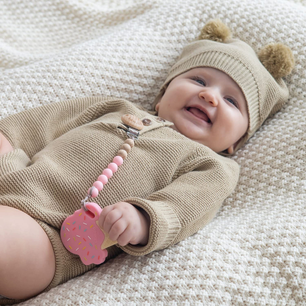 SAMiGO binky holder in lavender emphasizes easy cleaning with warm water.