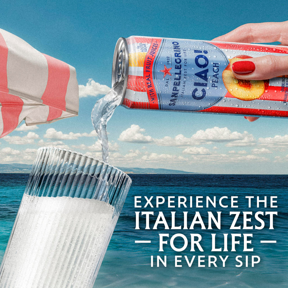 Bubbly San Pellegrino CIAO peach in a glass showing lively fizz.
