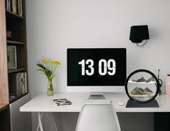 SANDCLE relaxing desk decor with a rotating sand sculpture.