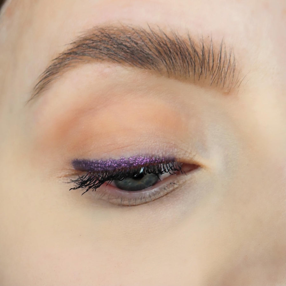 Sandstone Scandinavia Eyeliner Purple application on lash line offers precise, even color.