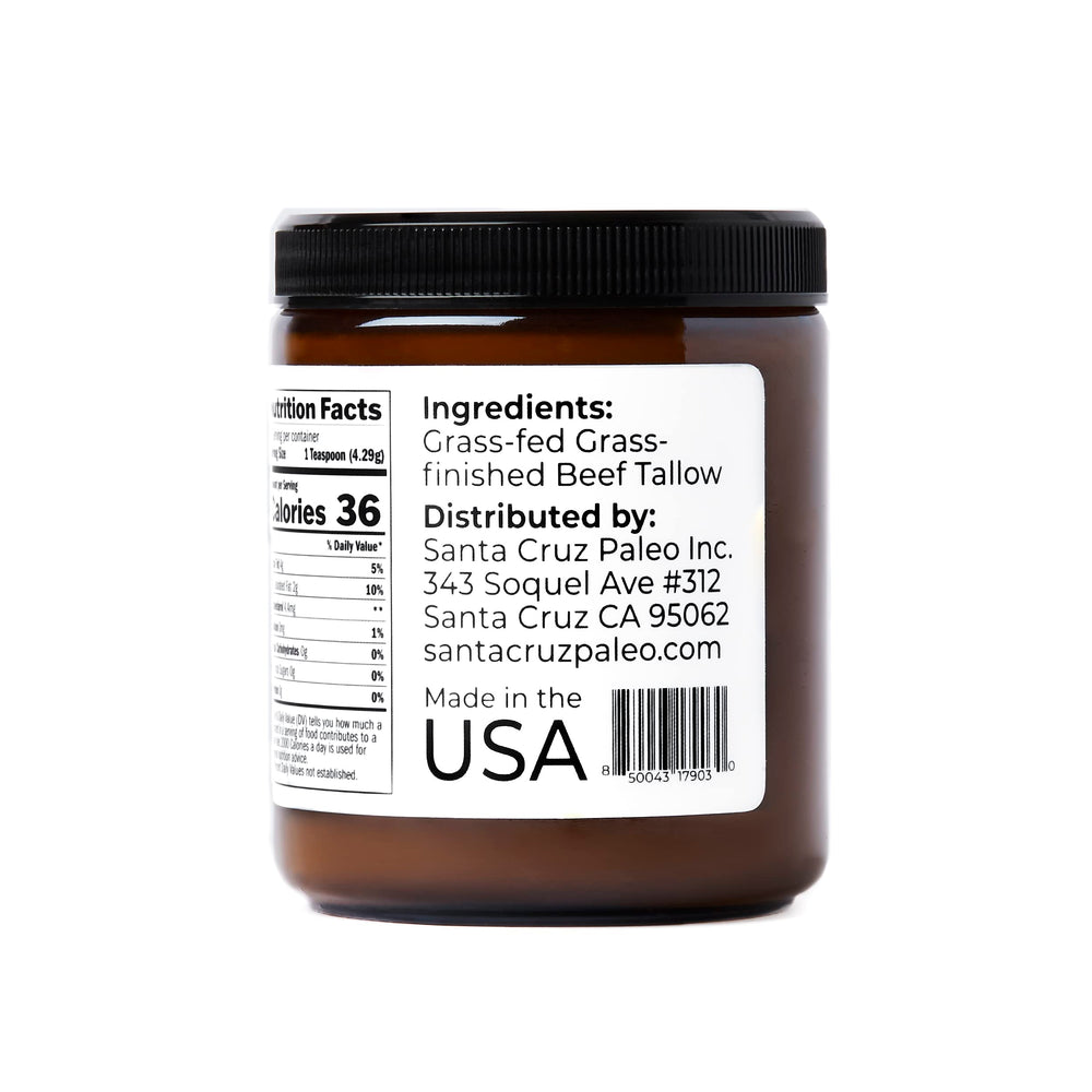 Glass jar of Santa Cruz Paleo beef tallow on clean surface.
