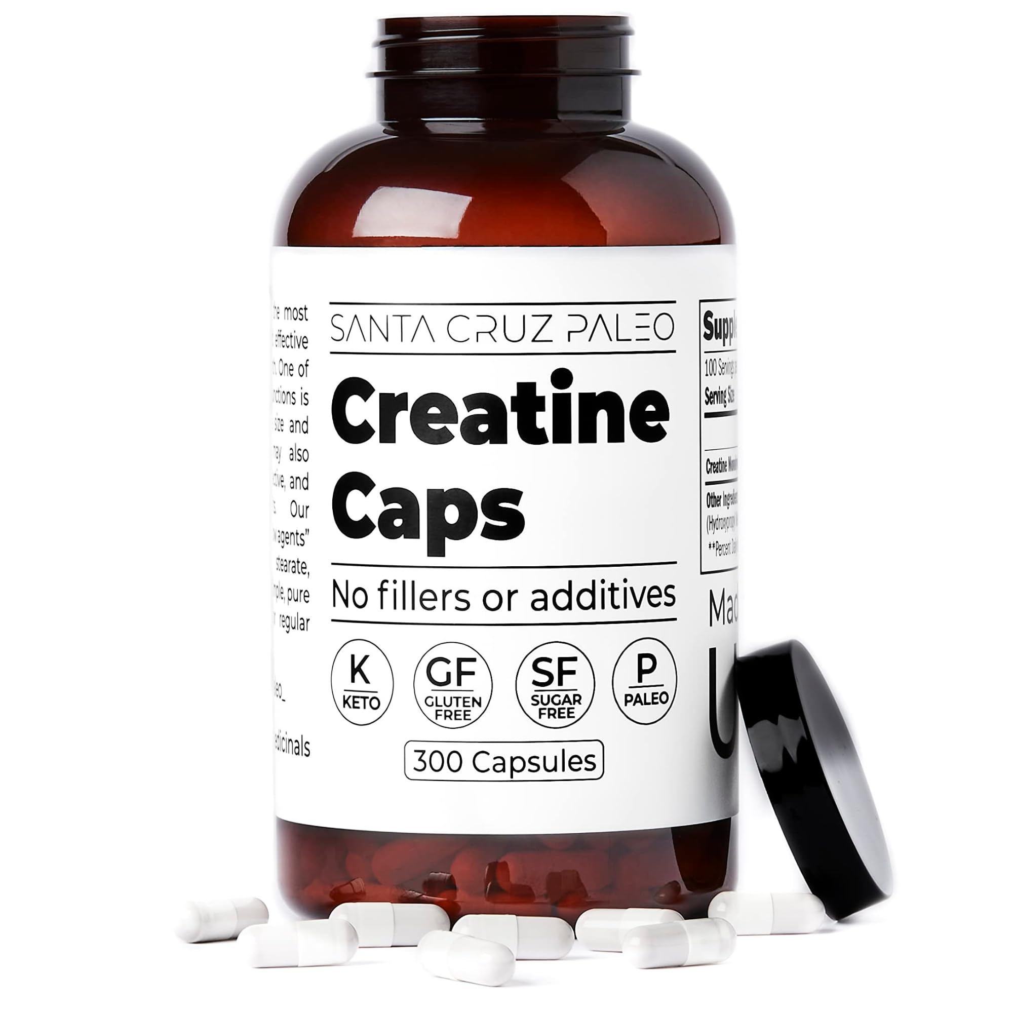 Santa Cruz Paleo Creatine bottle on gym mat with equipment.