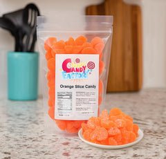 Sarah's Candy Factory orange slices gummy holiday setup suggests festive treats for gatherings.