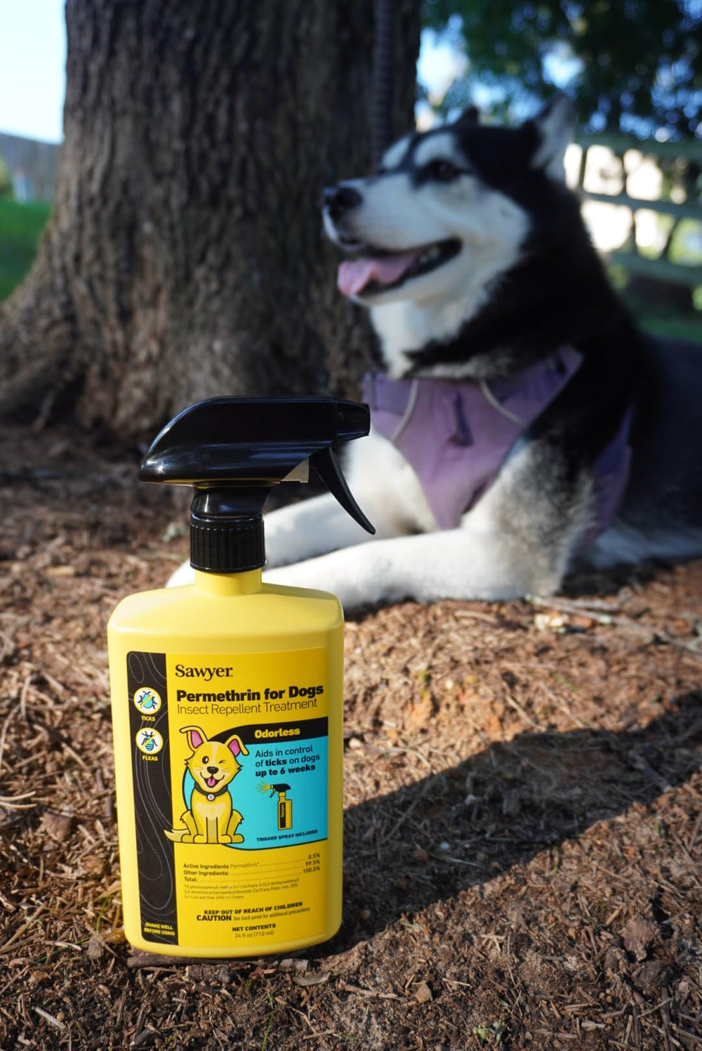 Sawyer Permethrin fabric treatment being applied to clothing to repel insects.