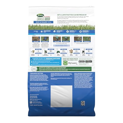 Spreading Scotts Sun & Shade mix with a spreader for even seed distribution