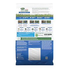 Spreading Scotts Sun & Shade mix with a spreader for even seed distribution