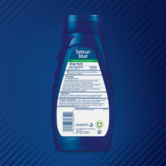 Selsun Blue shampoo bottle with aloe nourishes dry hair and scalp.