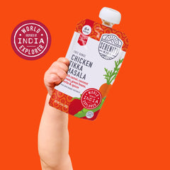 Serenity Kids pouch held in parent’s hand during park outing, easy outdoor snack.