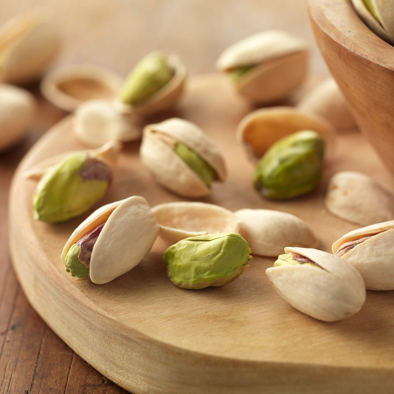 Setton Farms pistachios in bowl highlight topping versatility for salads.