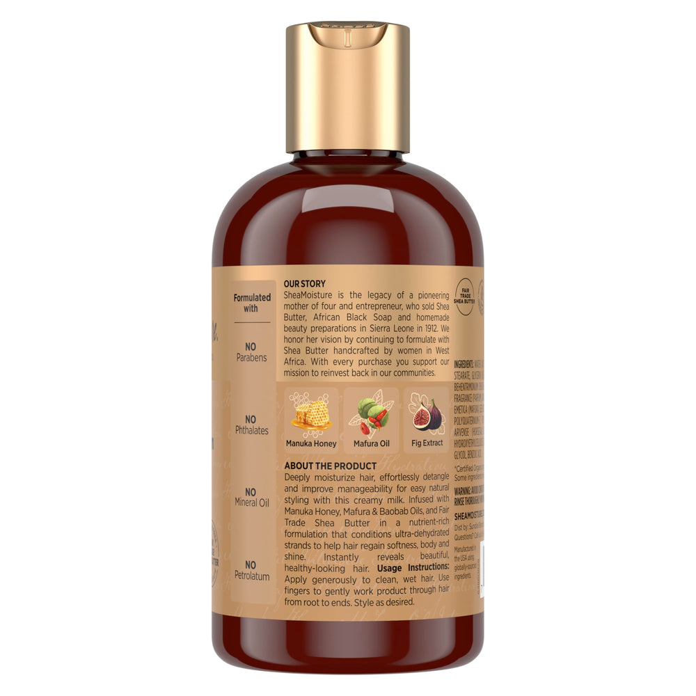 Pump dispensing SheaMoisture Hydration Hair Milk on a surface