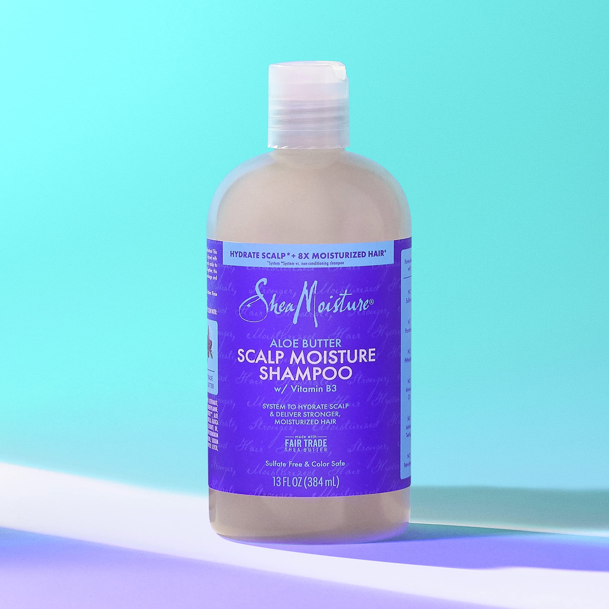 Fair Trade Shea Butter imagery on SheaMoisture Scalp Moisture Shampoo