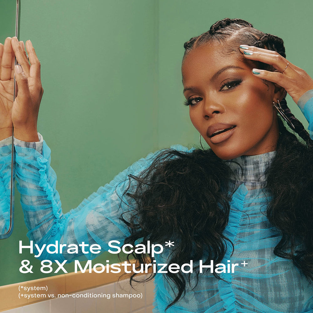 Wet hair with SheaMoisture Scalp Moisture Shampoo being applied to scalp