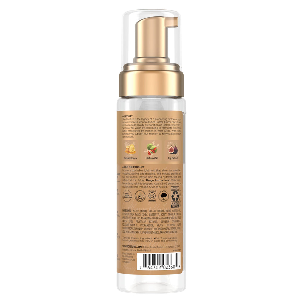 Hands divide damp hair to apply 2-3 pumps per section for styling.