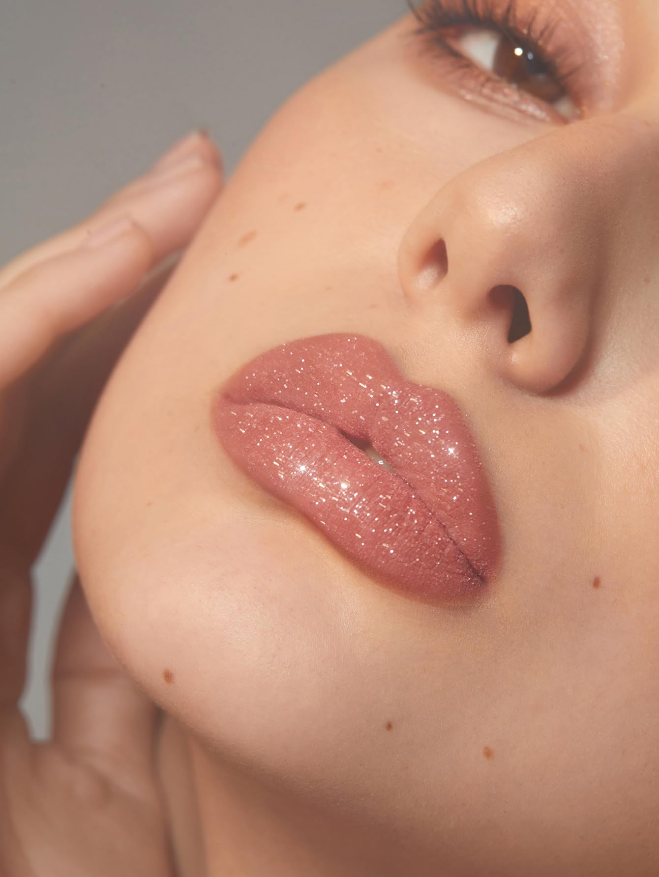SHEGLAM Lip Dazzler shown on lips with long-lasting shine and easy removal.