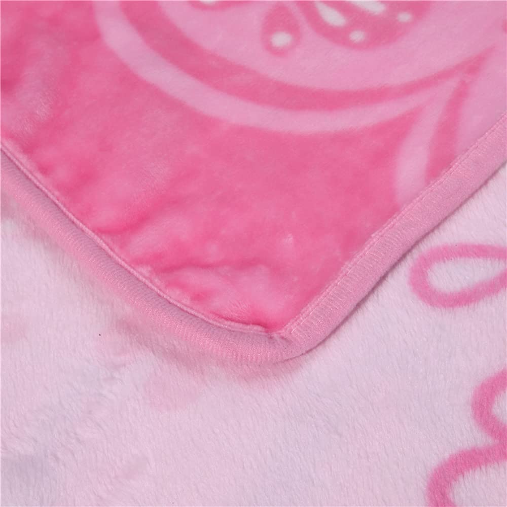 SIKYUCOR cartoon throw blanket pink on bed offers cozy, all-season comfort