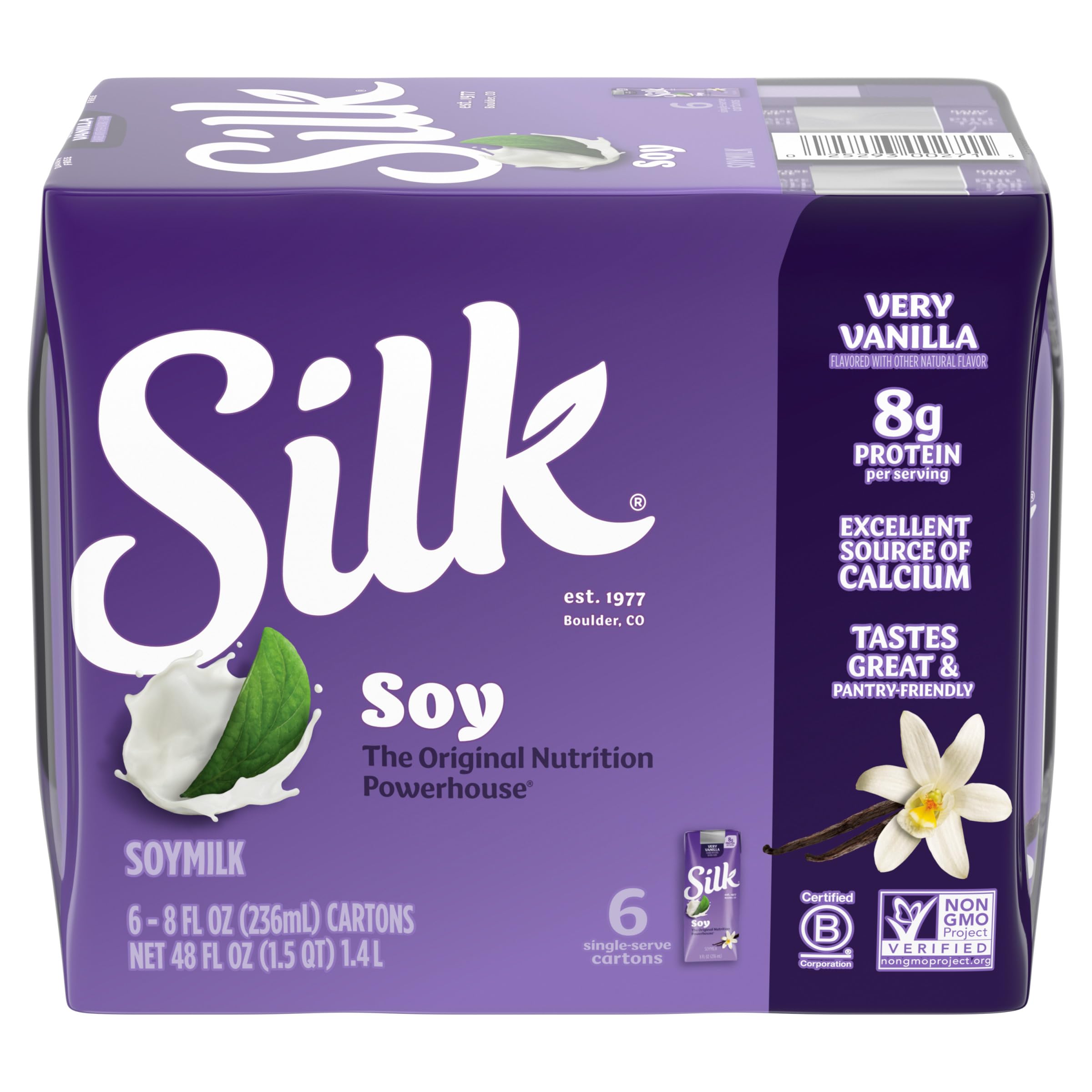 Silk soy milk singles very vanilla being poured into a glass for a creamy sip.