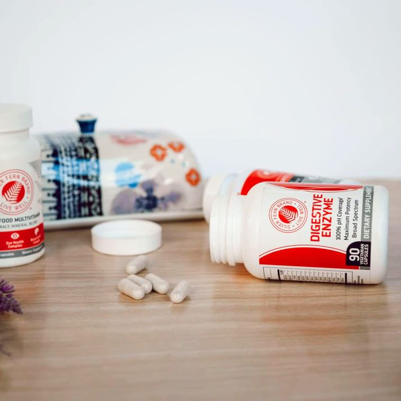 Capsules next to food items showing protein digestion support and versatility.