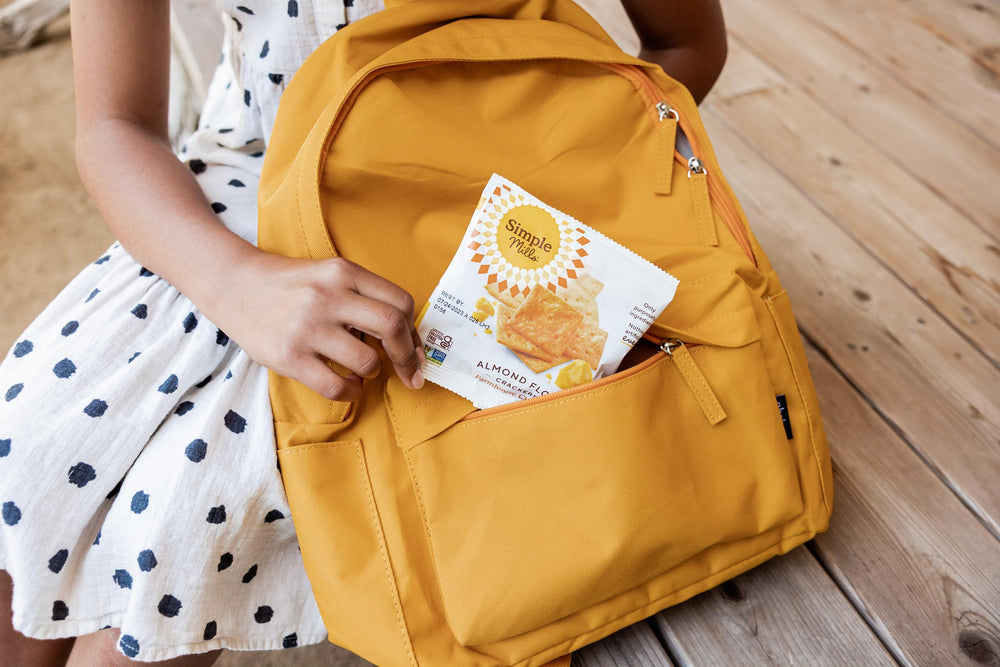 Ready-to-eat Simple Mills Farmhouse Cheddar crackers for on-the-go snacking