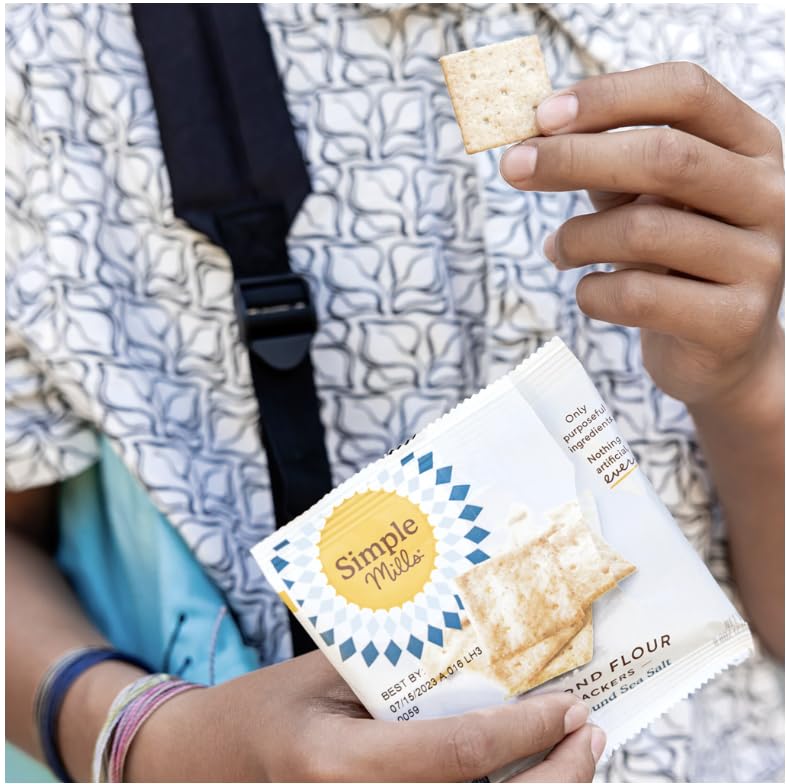 Simple Mills gluten-free crackers on a cheese board offering gluten-free crunch