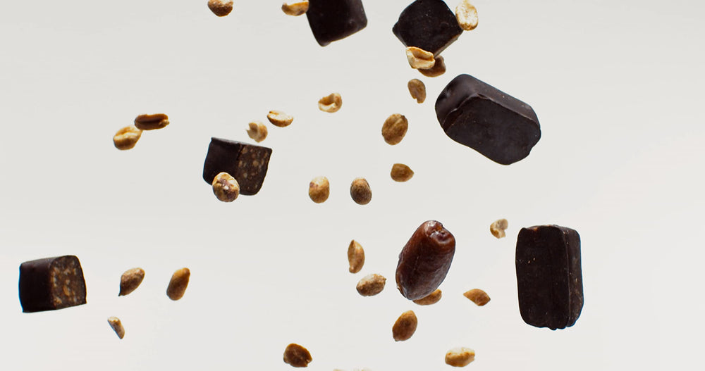 Chocolate-coated bar highlights fair trade chocolate and coconut sugar sweetness.