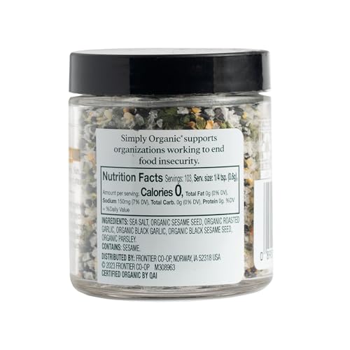 Simply Organic Black Garlic Finishing Salts being sprinkled on grilled meat for savory finish