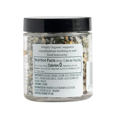 Simply Organic Black Garlic Finishing Salts being sprinkled on grilled meat for savory finish