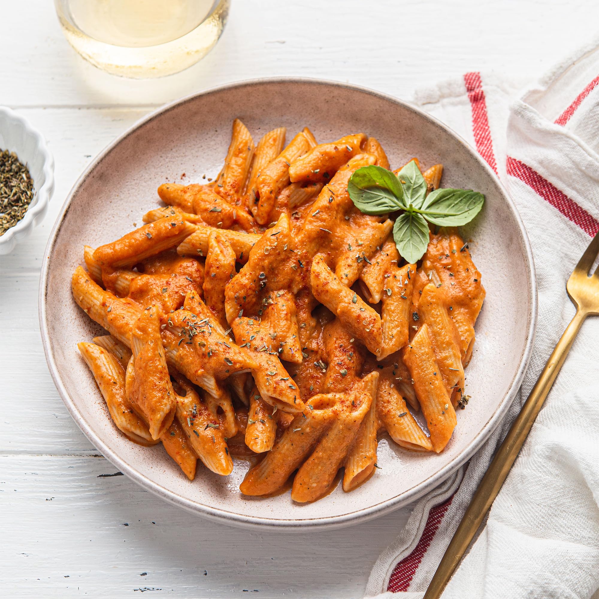 Pour-spout of Simply Organic Italian seasoning for quick, even seasoning.