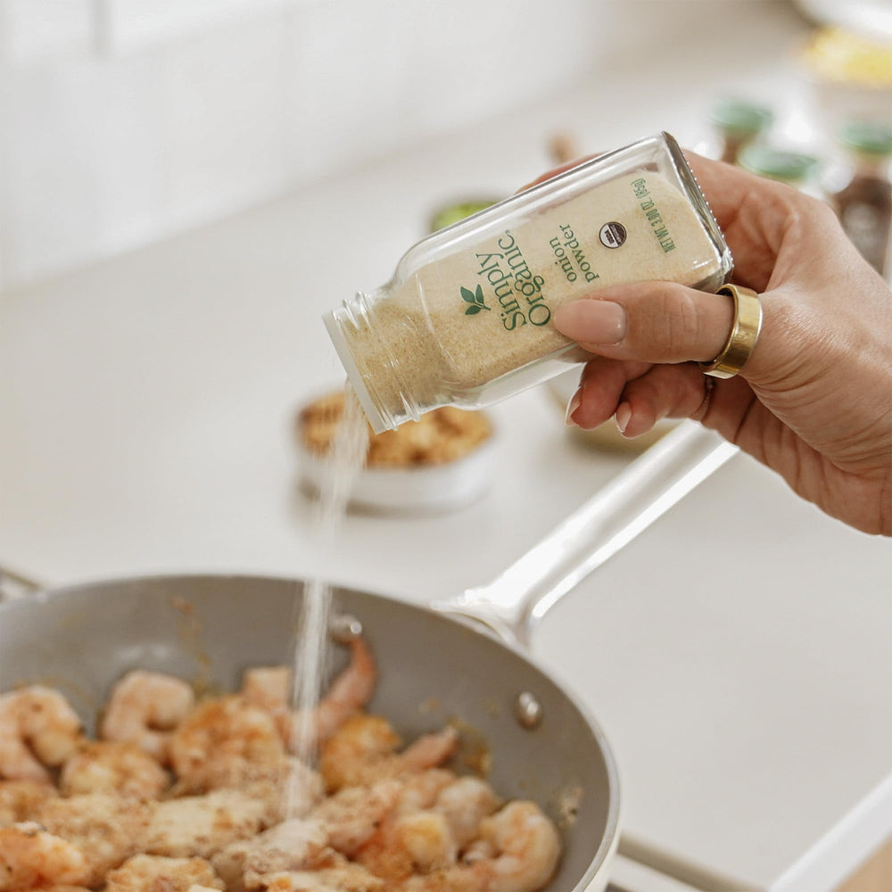Label on Simply Organic Onion Powder packaging highlights organic and kosher certifications.