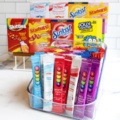 Singles To Go! licensed-brand flavors collection shows Sonic, Starburst, Skittles variety.