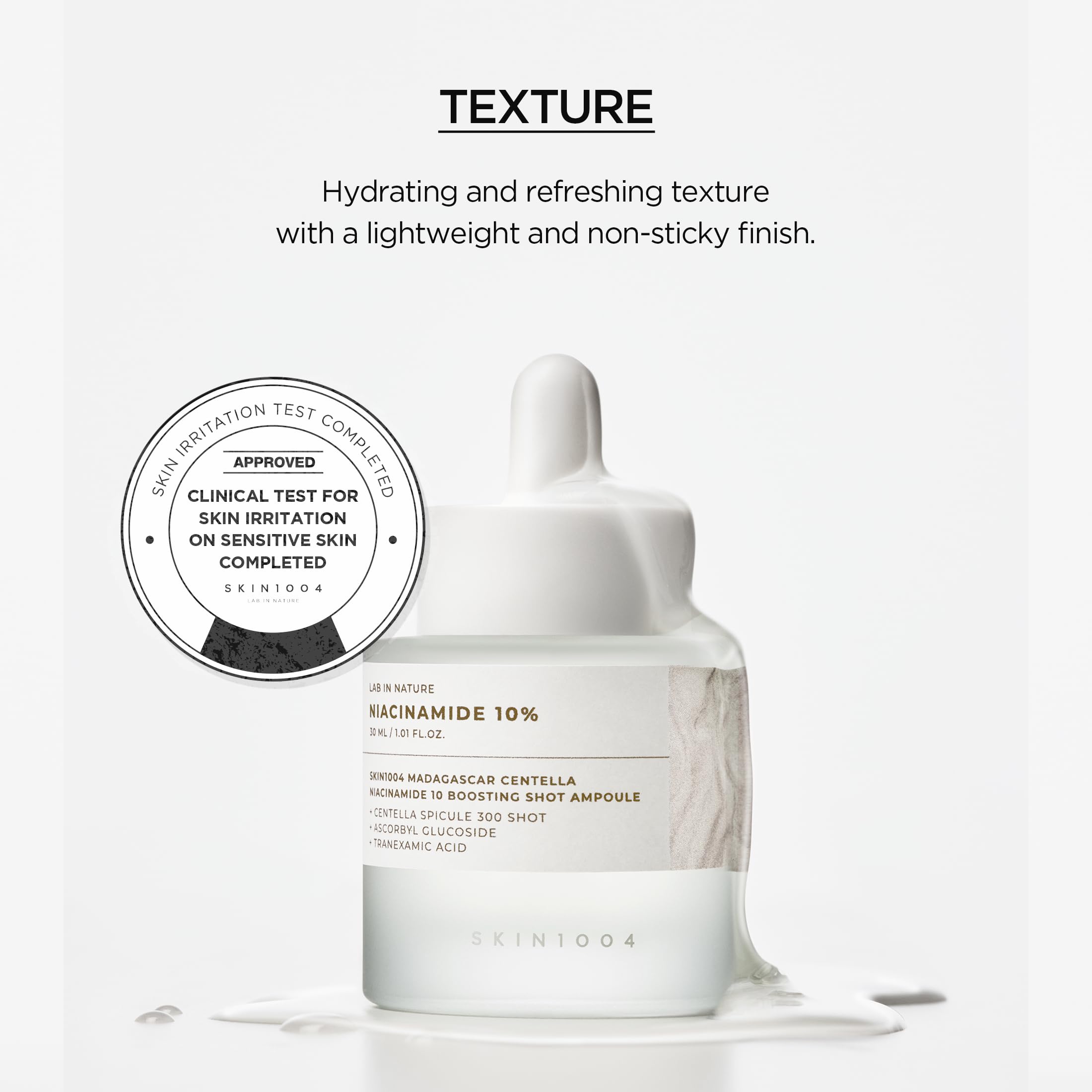 SKIN1004 Ampoule dropper in use over fingertip.