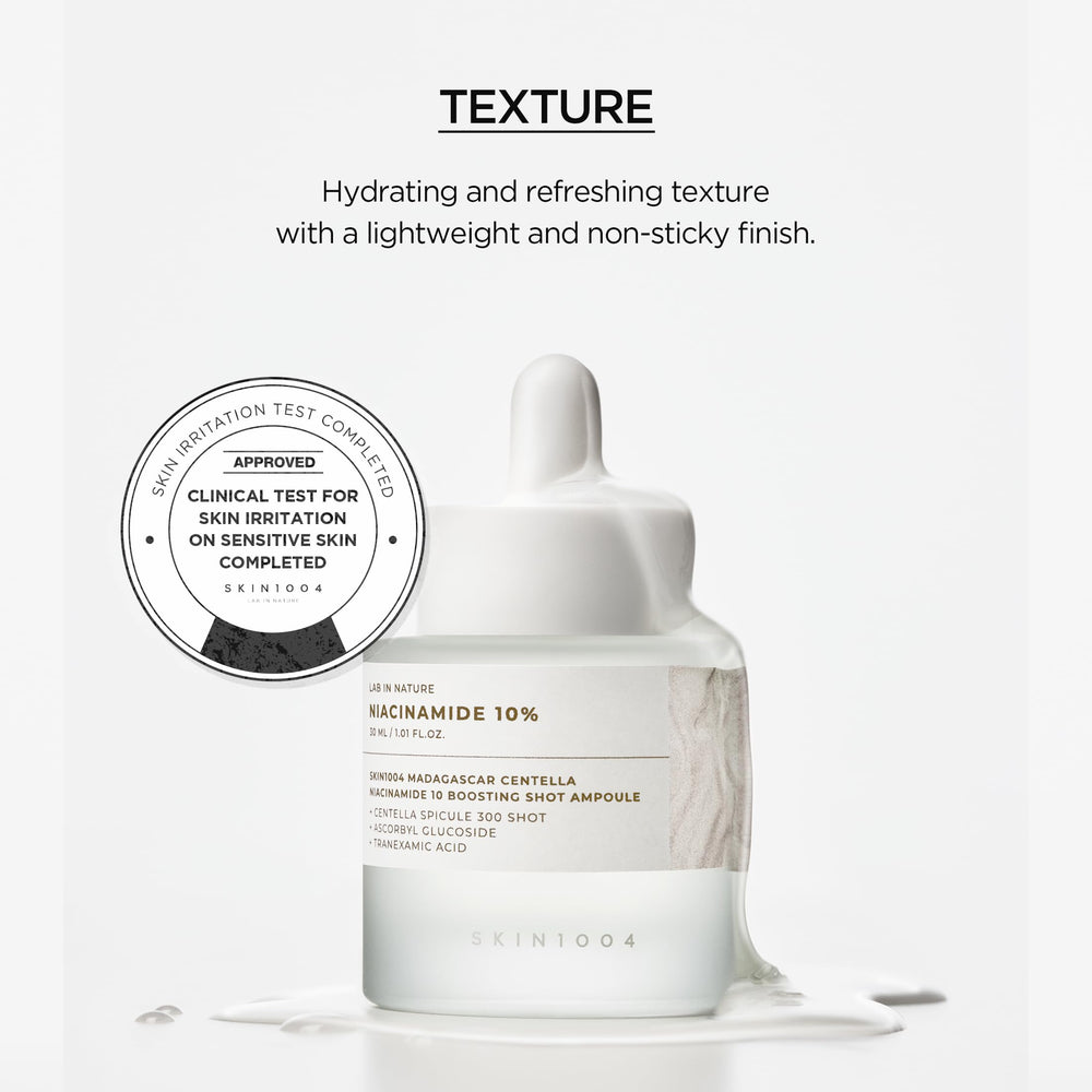 SKIN1004 Ampoule dropper in use over fingertip.