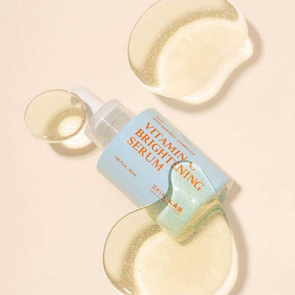 SKIN&LAB Serum glass bottle on clean vanity backdrop.
