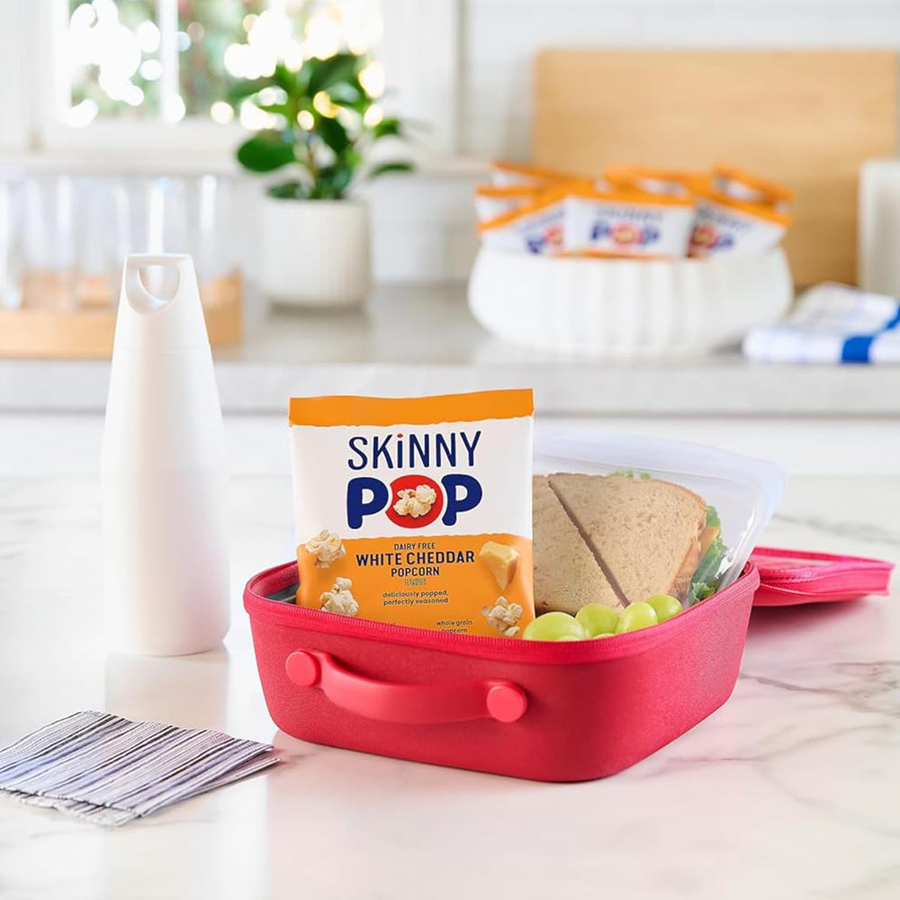 SkinnyPop White Cheddar close-up highlighting savory flavor and texture.