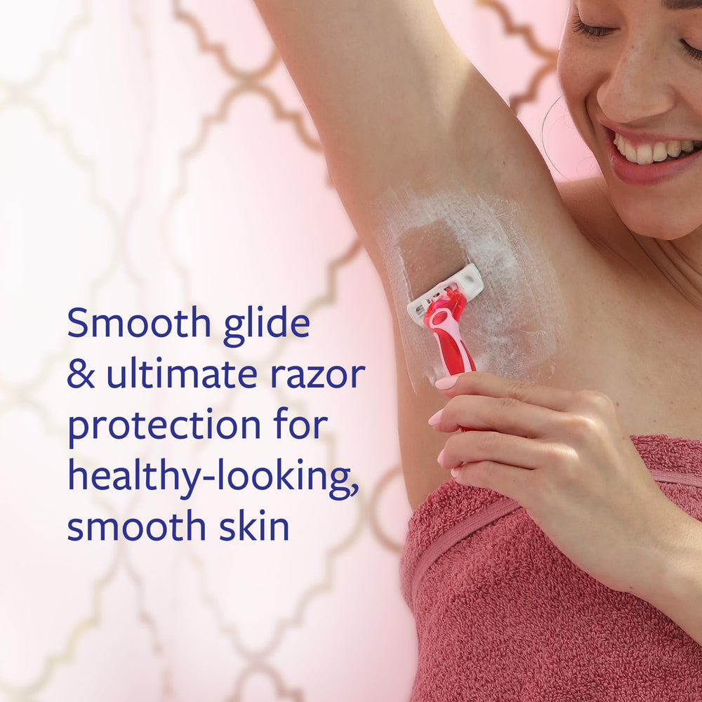 Skintimate Skin Therapy bottle with lanolin and vitamin E nourishes dry skin during shaving.